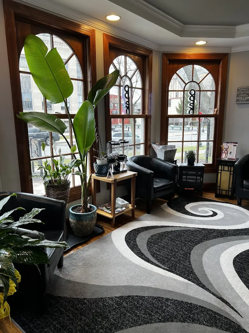 Bright seating area with large windows at Buffalo Holistic Center, a detox center in Buffalo.