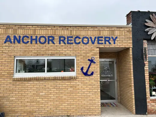 Brick exterior with blue anchor sign at Anchor Recovery, an intensive outpatient program in Buffalo.