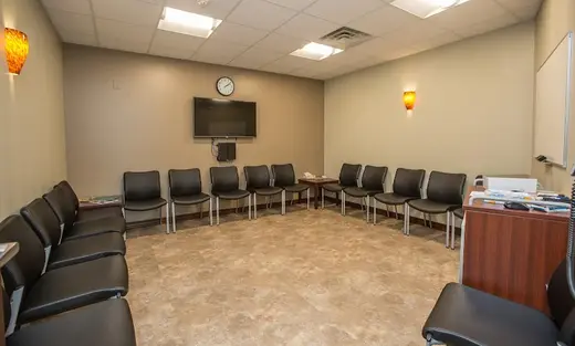 Comfortable seating area for group sessions at Horizon Health Services: Broadway R, a sober living home in Buffalo.